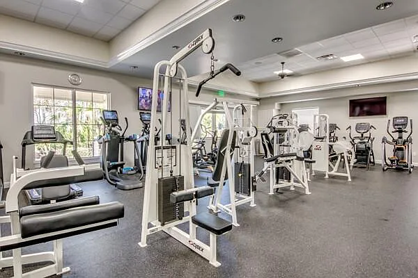 Sandoval fitness center / gym interior with cardio and strength machines