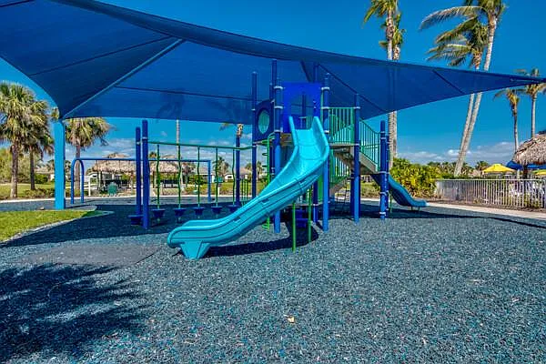 Sandoval children's playground with shade sails and slide