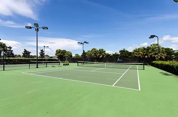 Sandoval lighted tennis courts — hard courts with lake backdrop